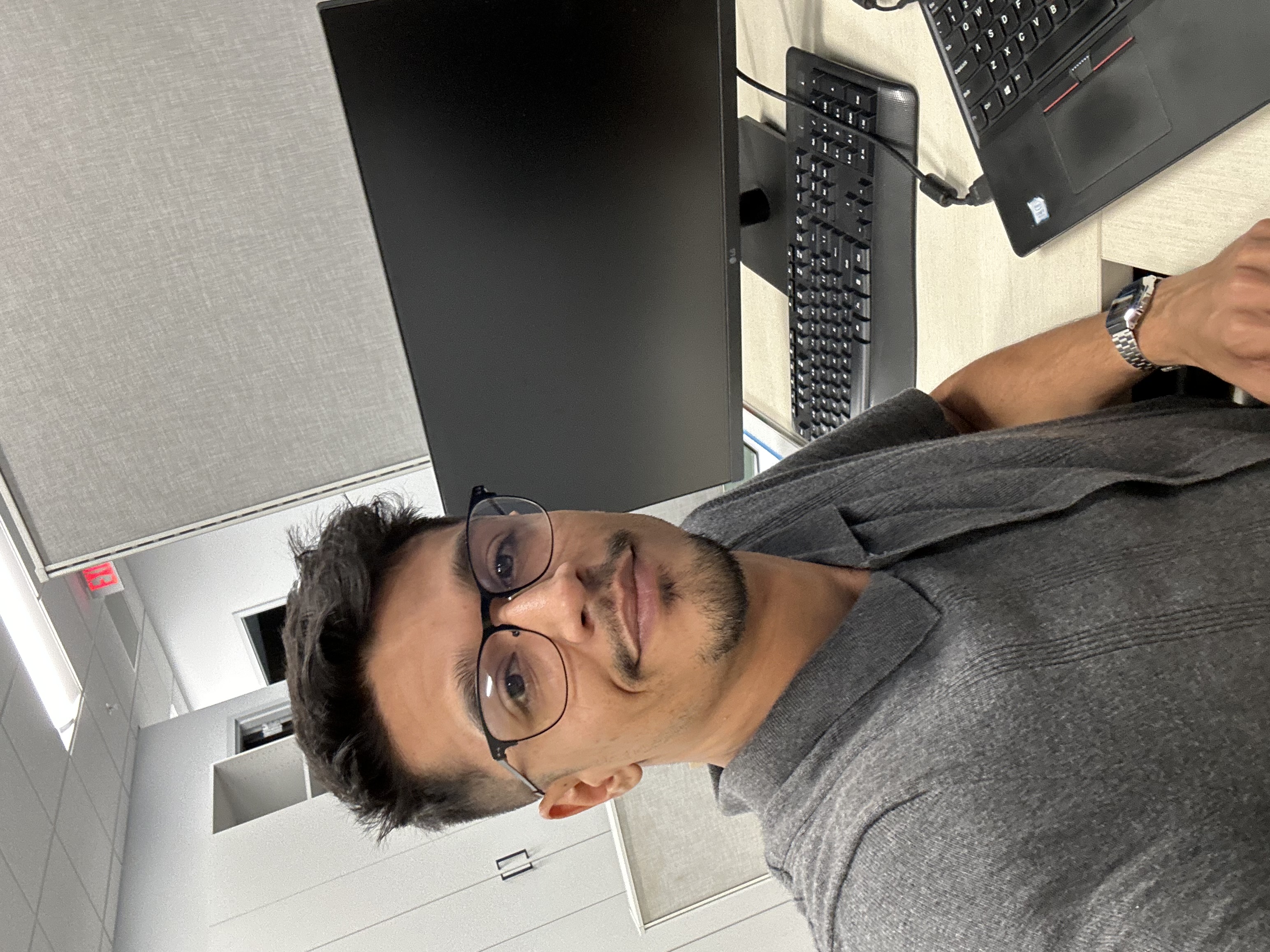 Keanu Gomes at his desk - Full Stack Developer, AI/ML Engineer